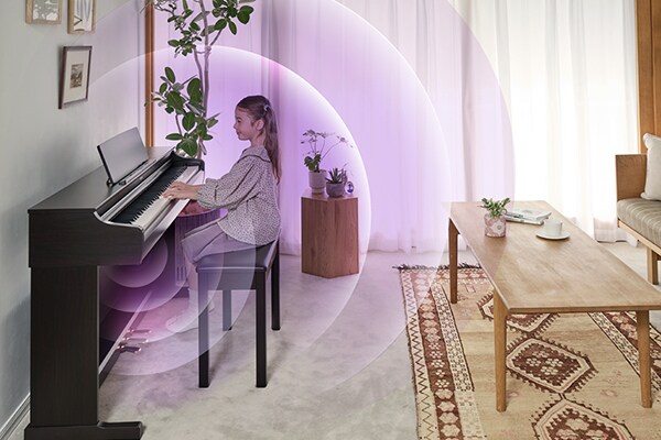 Sound waves expanding from an ARIUS piano in a living room