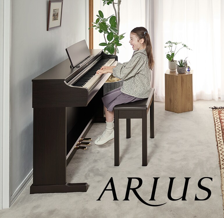 A girl playing an ARIUS digital piano at home, demonstrating an ever-growing musicality and deeper emotional expression.