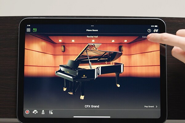 A tablet screen showing the Smart Pianist app in use