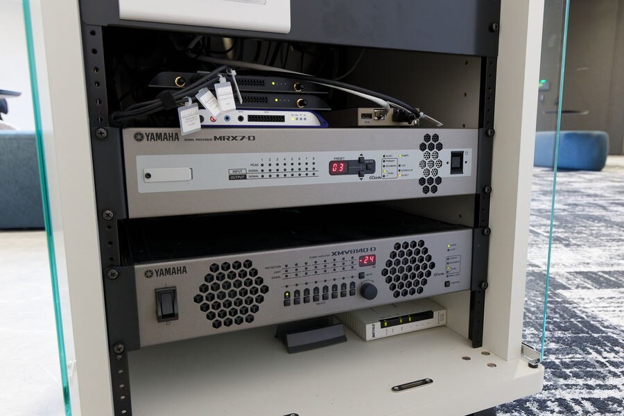 MRX7-D signal processor (top) and XMV8140-D power amplifier (bottom) installed in an equipment rack
